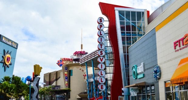 Vibrant storefronts and lively signs like Splitsville welcome Disney Springs fans exploring shopping, dining, and entertainment.
