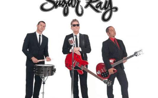 Sugar Ray band members in suits pose with instruments under their logo, ready to perform at EPCOT's International Food & Wine Festival.