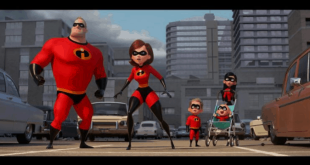 The Incredibles strike action poses in red suits on a city-themed street at Walt Disney World’s exclusive Incredibles 2 preview.