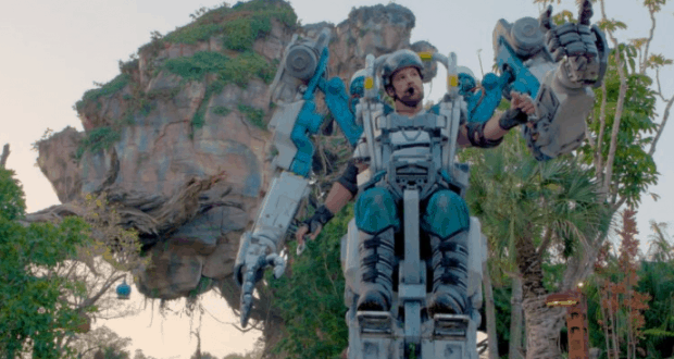 A giant mechanical exosuit towers on Pandora, with Avatar’s iconic floating mountains and lush alien forest at Disney’s Animal Kingdom.