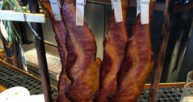 Bacon fans, don’t miss this: four crispy strips hung on clothespins, served at Disney World—an iconic foodie experience!.