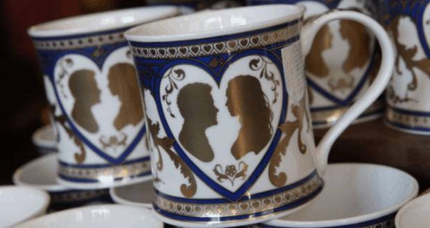 White mugs with blue and gold heart designs featuring Disney couple silhouettes—ideal keepsakes for Walt Disney World fans.