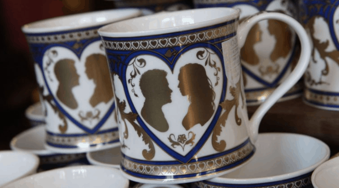 White mugs with blue and gold heart designs featuring Disney couple silhouettes—ideal keepsakes for Walt Disney World fans.