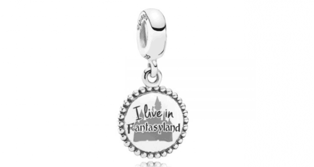 Silver PANDORA charm with beaded edge, "I live in Fantasyland" engraving, and castle outline—Disney World magic in jewelry.