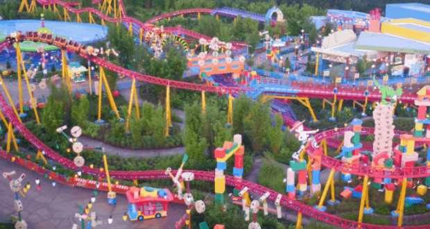 Toy Story Land at Walt Disney World bursts with color, winding coasters, and playful décor in a lush, vibrant park setting.