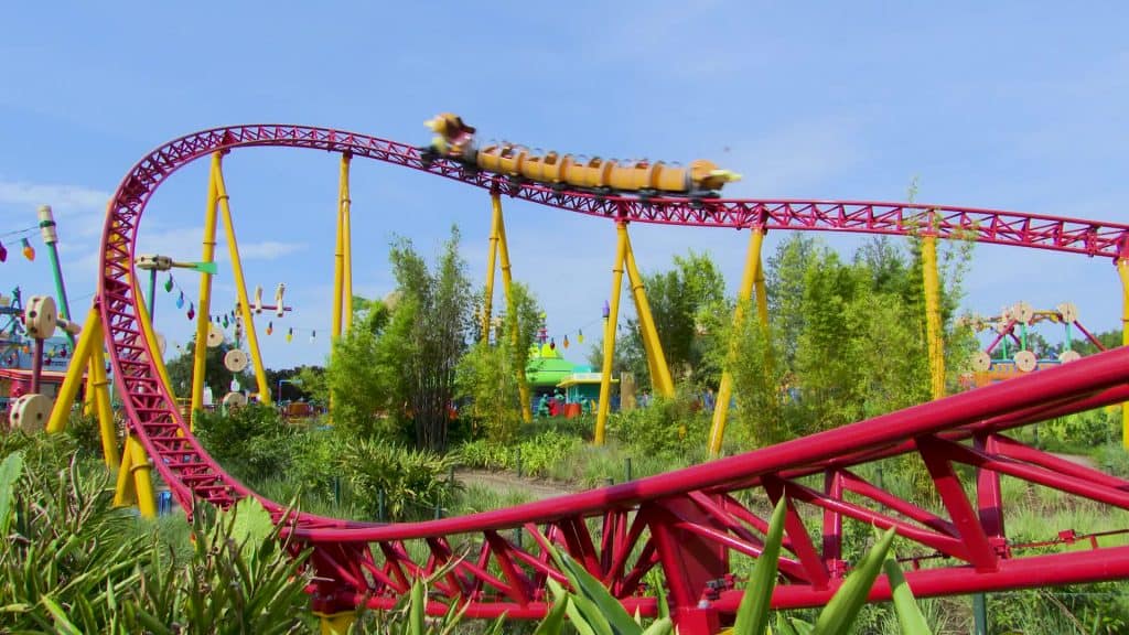 Slinky Dog Dash races through lush Toy Story Land, twisting beneath a sunny sky at Disney’s Hollywood Studios in Walt Disney World.