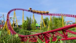 Slinky Dog Dash races through lush Toy Story Land, twisting beneath a sunny sky at Disney’s Hollywood Studios in Walt Disney World.