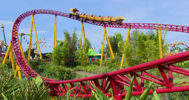 Slinky Dog Dash races through lush Toy Story Land, twisting beneath a sunny sky at Disney’s Hollywood Studios in Walt Disney World.