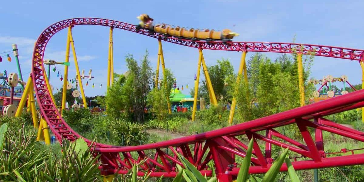 Slinky Dog Dash races through lush Toy Story Land, twisting beneath a sunny sky at Disney’s Hollywood Studios in Walt Disney World.