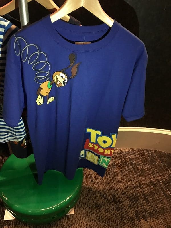 Slinky Dog t-shirt from Toy Story Land at Walt Disney World, with a playful Slinky graphic and vibrant Toy Story logo by the hem.