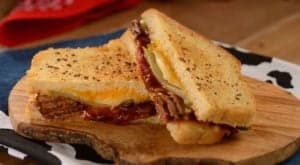 Barbecue meat and melted cheese sandwich with pickles, just like at Woody’s Lunch Box in Disney’s Hollywood Studios.