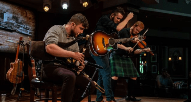 Raglan Road musicians dazzle guests with bagpipes, guitar, and a kilted fiddler at the lively Great Irish Hooley at Disney World.