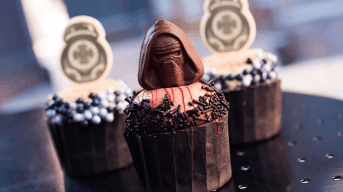 Kylo Ren chocolate cupcake in front of BB-8 cupcakes, part of Star Wars treats at Hollywood Studios, Walt Disney World.