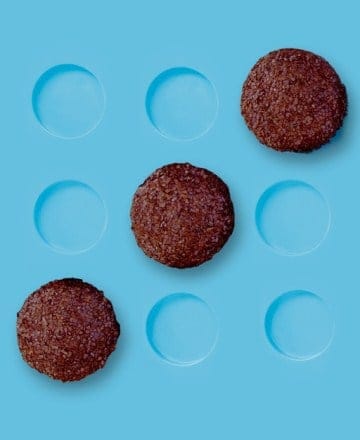 Five Disney Springs-style chocolate treats pop against a blue backdrop, with four empty spots hinting at a magical dessert lineup.