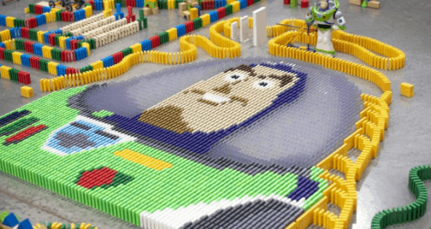 Buzz Lightyear’s face and suit formed from dominoes, with a Buzz toy behind—just like at Toy Story Land in Walt Disney World.