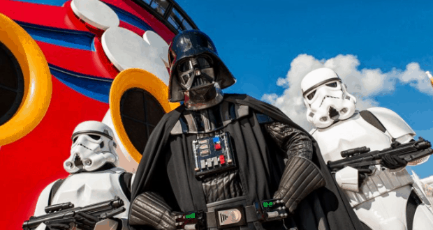 Darth Vader and Stormtroopers in costume greet fans by a Disney Cruise ship with Mickey Mouse art for Star Wars Day at Sea.