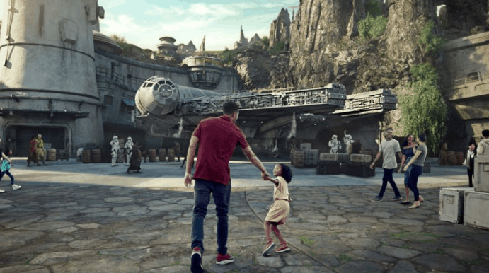 Guests make their way toward the iconic Millennium Falcon in Star Wars: Galaxy’s Edge at Disneyland Resort.