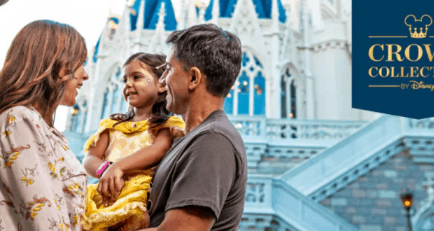 Happy family poses in front of Cinderella Castle at Walt Disney World, next to a “Crown Collection by Disney” sign.