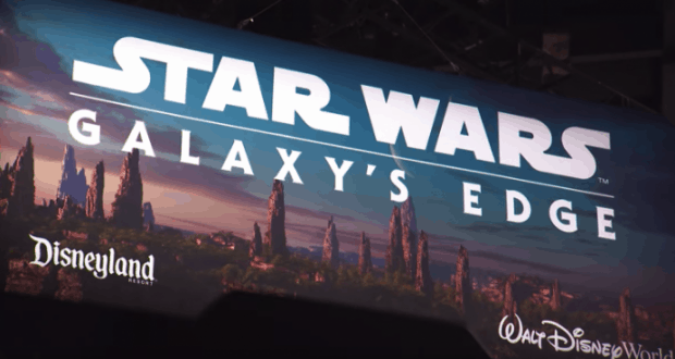 Star Wars: Galaxy’s Edge sign at Disneyland Resort and Walt Disney World, set against rocky terrain, invites fans to explore.