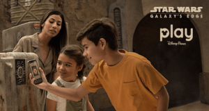 Visitors at Black Spire Outpost in Star Wars: Galaxy's Edge use the Play Disney Parks App to enhance their immersive adventure.