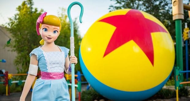 Bo Peep poses beside the iconic Pixar ball, bringing Toy Story 4 magic to Walt Disney World’s merchandise scene.