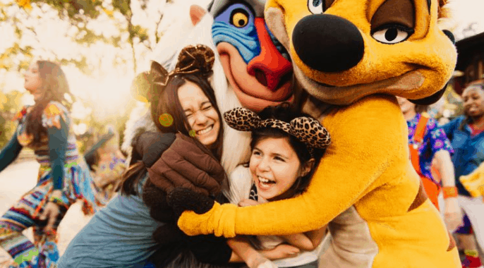 Guests share a sunlit hug with Rafiki and Timon at Walt Disney World—a magical moment for Florida Residents enjoying special tickets.