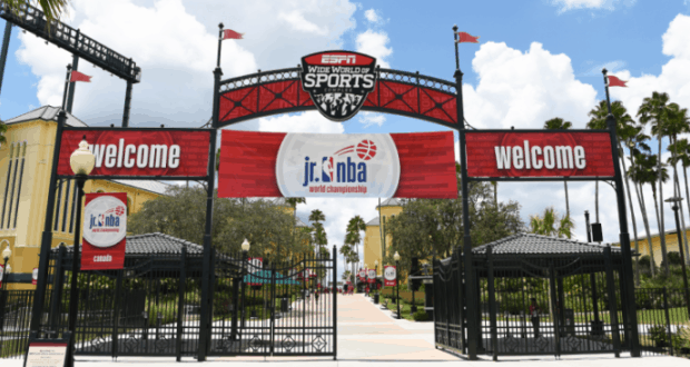 ESPN Wide World of Sports entrance at Walt Disney World, featuring festive "Welcome" signs and a 2019 Jr. NBA banner.