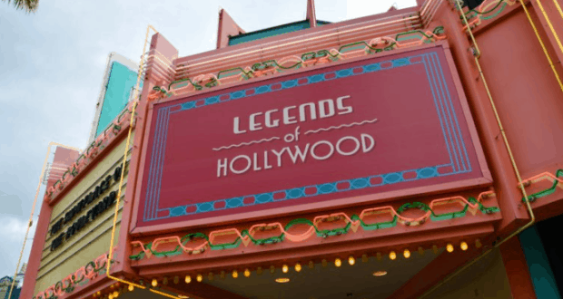 Legends of Hollywood art deco marquee in pink and teal lights up Disney’s Hollywood Studios, inviting guests inside.