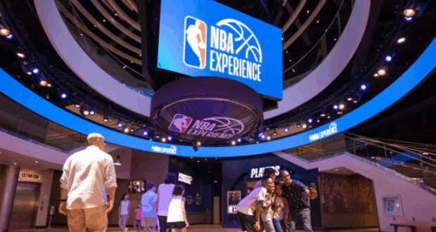 Step into the NBA Experience’s interactive zone, where towering signs and digital screens capture the magic of Disney World.