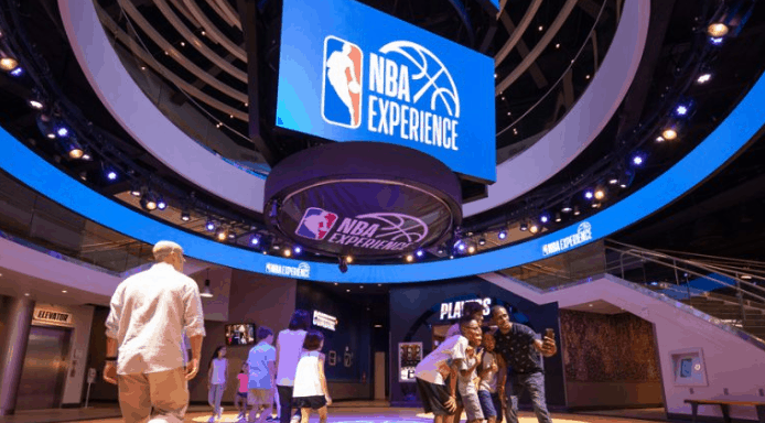 Step into the NBA Experience’s interactive zone, where towering signs and digital screens capture the magic of Disney World.