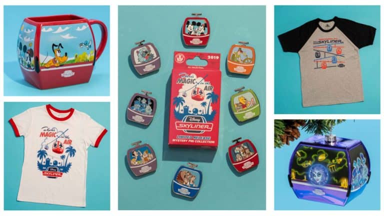 Disney Skyliner mugs, shirts, ornaments, and a collectible pin showcased on a blue surface for Walt Disney World fans.