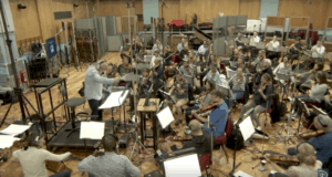 The Epcot Forever orchestra rehearses in the studio, led by their conductor, to create the magic for Walt Disney World's nighttime show.