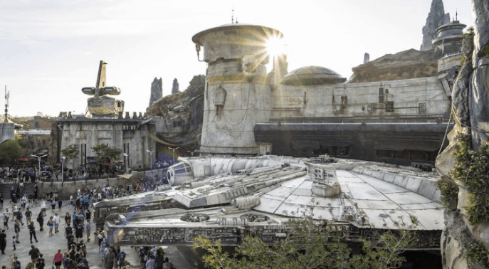 Fans explore the Millennium Falcon at Star Wars: Galaxy’s Edge, surrounded by immersive sights and crowds at Walt Disney World.
