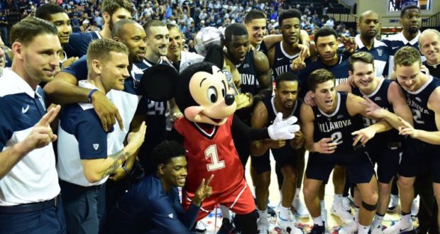 Mickey Mouse joins the Villanova basketball team for a cheerful group photo on court at Disney World’s 2019 Orlando Invitational.