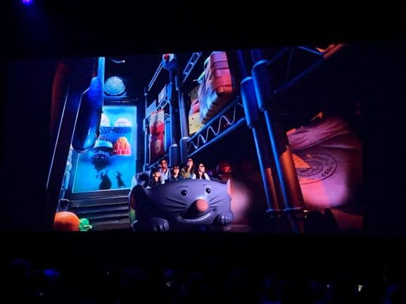 Guests journey in a mouse-shaped ride vehicle through oversized kitchen scenes on Remy’s Ratatouille Adventure at Epcot.