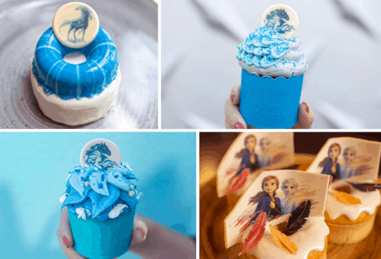 Frozen 2-inspired blue and white cupcakes with character toppers and decorative icing, ready for your Disney World foodie adventure.