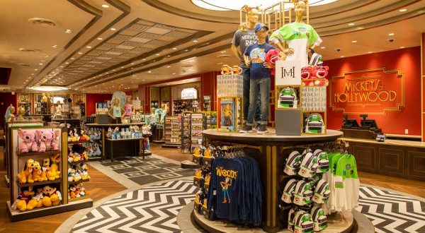 Mickey's of Hollywood, freshly reopened at Disney World, showcases Disney gear—plushies, apparel, and more—in a vibrant setting.