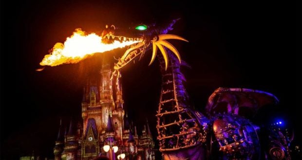 Maleficent’s fire-breathing dragon float lights up the night before Cinderella Castle at Disney Villains After Hours.