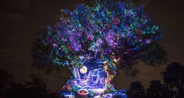 The Tree of Life at Animal Kingdom dazzles after dark with festive lights, holiday décor, and magical nighttime projections.