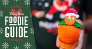 An orange-shaped holiday treat with a Santa hat by the Disney Parks Foodie Guide at Mickey's Very Merry Christmas Party.
