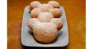 Classic Mickey Mouse-shaped beignets dusted with powdered sugar, served at Scat Cat Club—a must-try for Disney Annual Passholders.