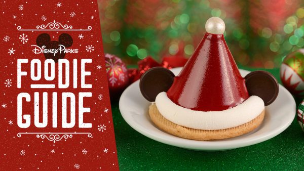 Mickey Mouse Santa hat dessert at Disney’s Hollywood Studios, displayed by the Foodie Guide sign for Holidays 2019 celebration.