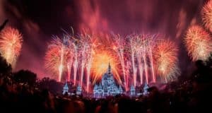 Spectacular fireworks illuminate Cinderella Castle at Disney World as excited guests gather to watch the magical nighttime show.