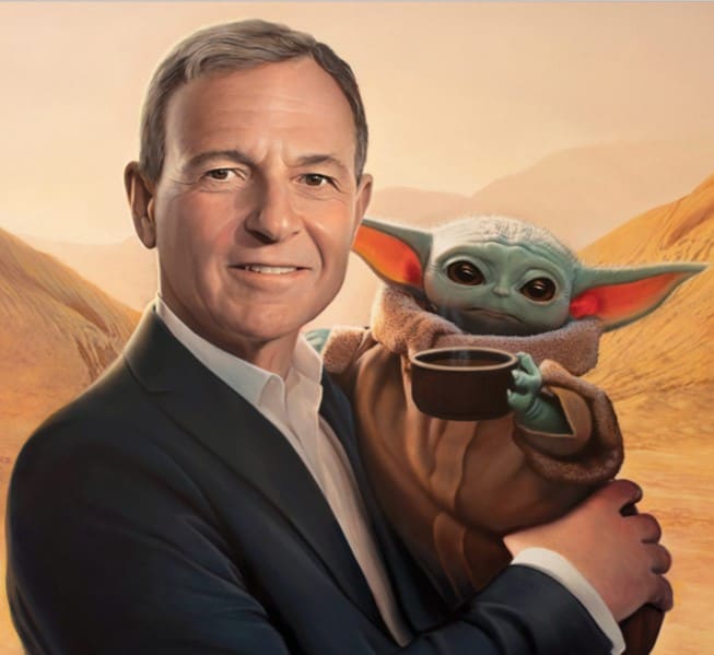 Bob Iger beams in a suit, cradling Baby Yoda with his signature bowl, set against a Star Wars–themed desert backdrop.