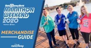 Four friends proudly display their marathon medals by the lake at Walt Disney World during the 2020 Marathon Weekend event.