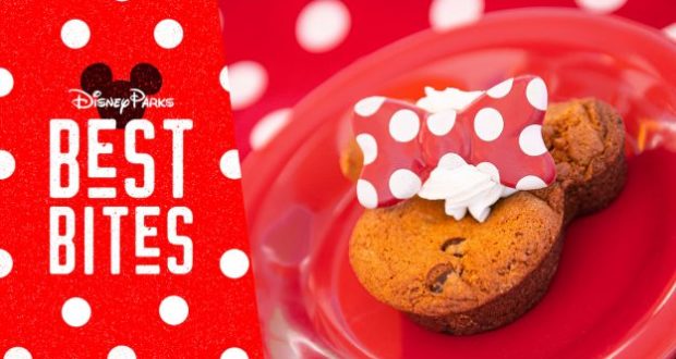 Mickey-shaped chocolate chip cookie topped with whipped cream and a red polka-dot bow on a red plate—Disney Parks Best Bite.