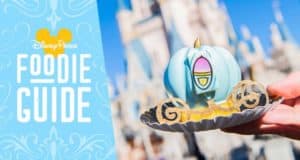 Cinderella Castle backdrop highlights a blue pumpkin dessert, featured in the Disney Parks Foodie Guide on the left.