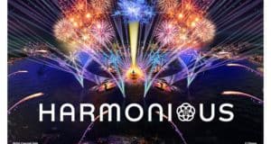 Spectacular EPCOT fireworks dazzle over the lagoon with “Harmonious” shining in bold white, celebrating Disney magic.