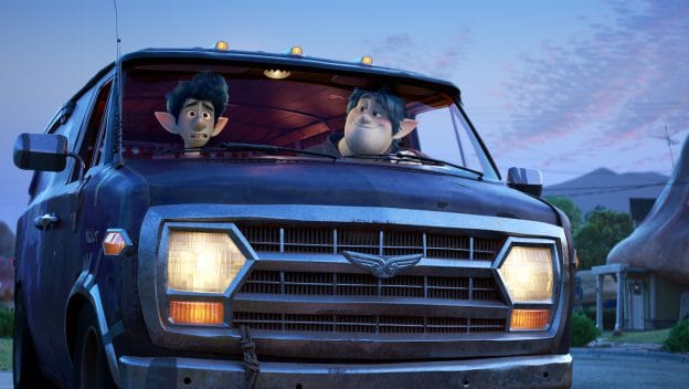 Ian and Barley Lightfoot ride in their beloved van through a whimsical fantasy suburb, as seen in Disney and Pixar’s Onward.