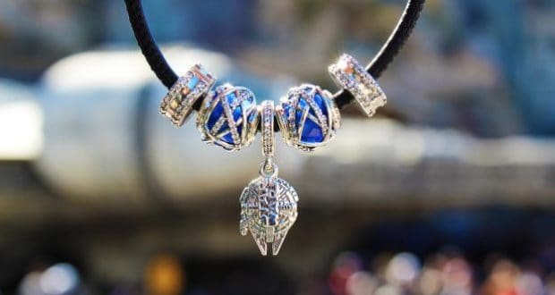 Star Wars necklace with blue and silver beads and a Mandalorian helmet charm, just right for fans exploring Galaxy’s Edge.